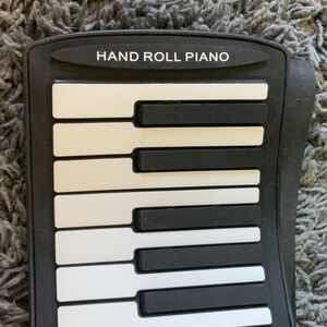 Portable Hand Roll Piano in Black and White
